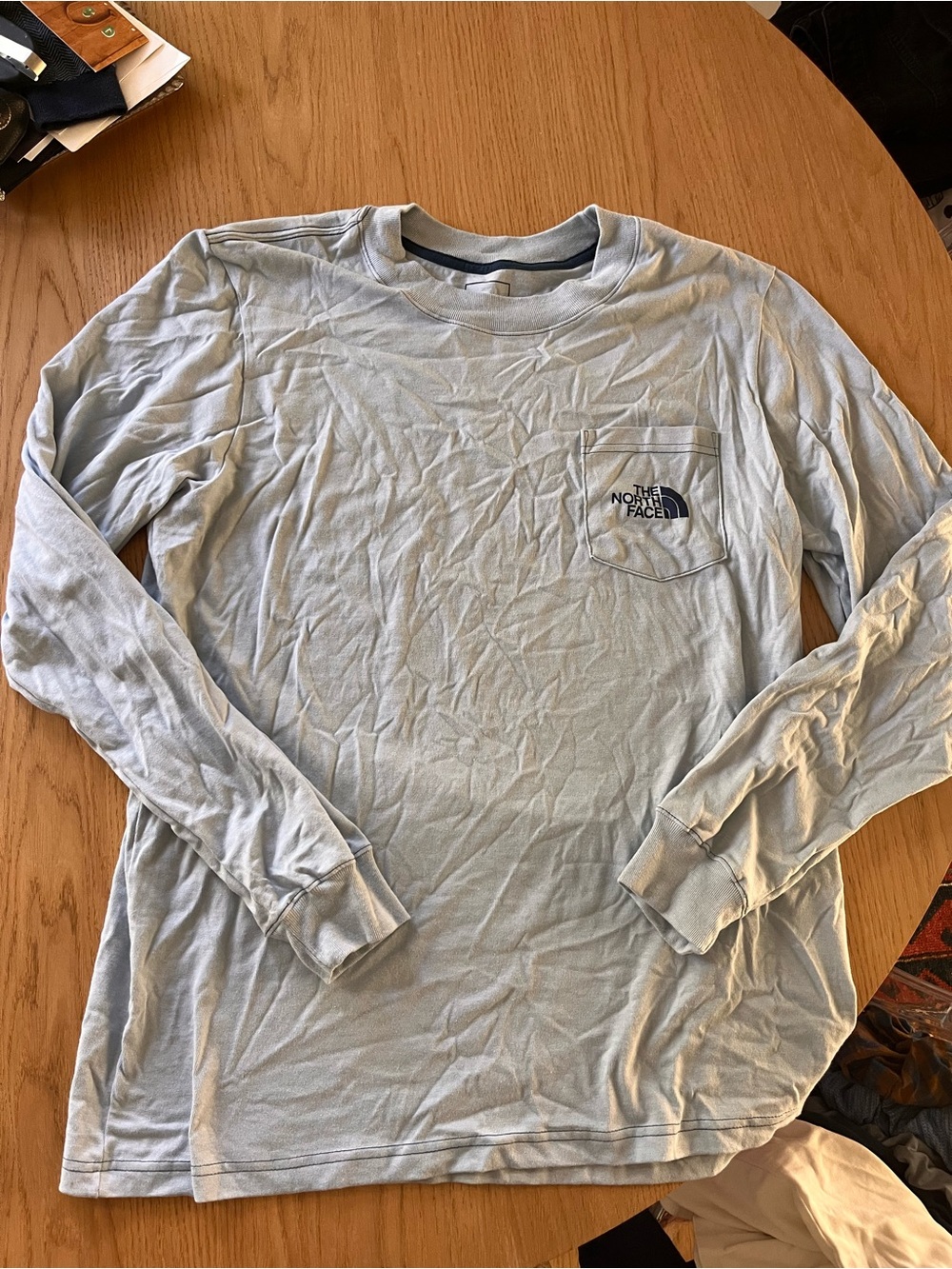 The North Face Men’s Long-Sleeve Pocket Tee with Carabiner graphic- Light Blue